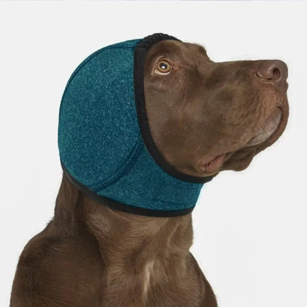 Heather green SnoozyPups ear muffs on a brown dog
